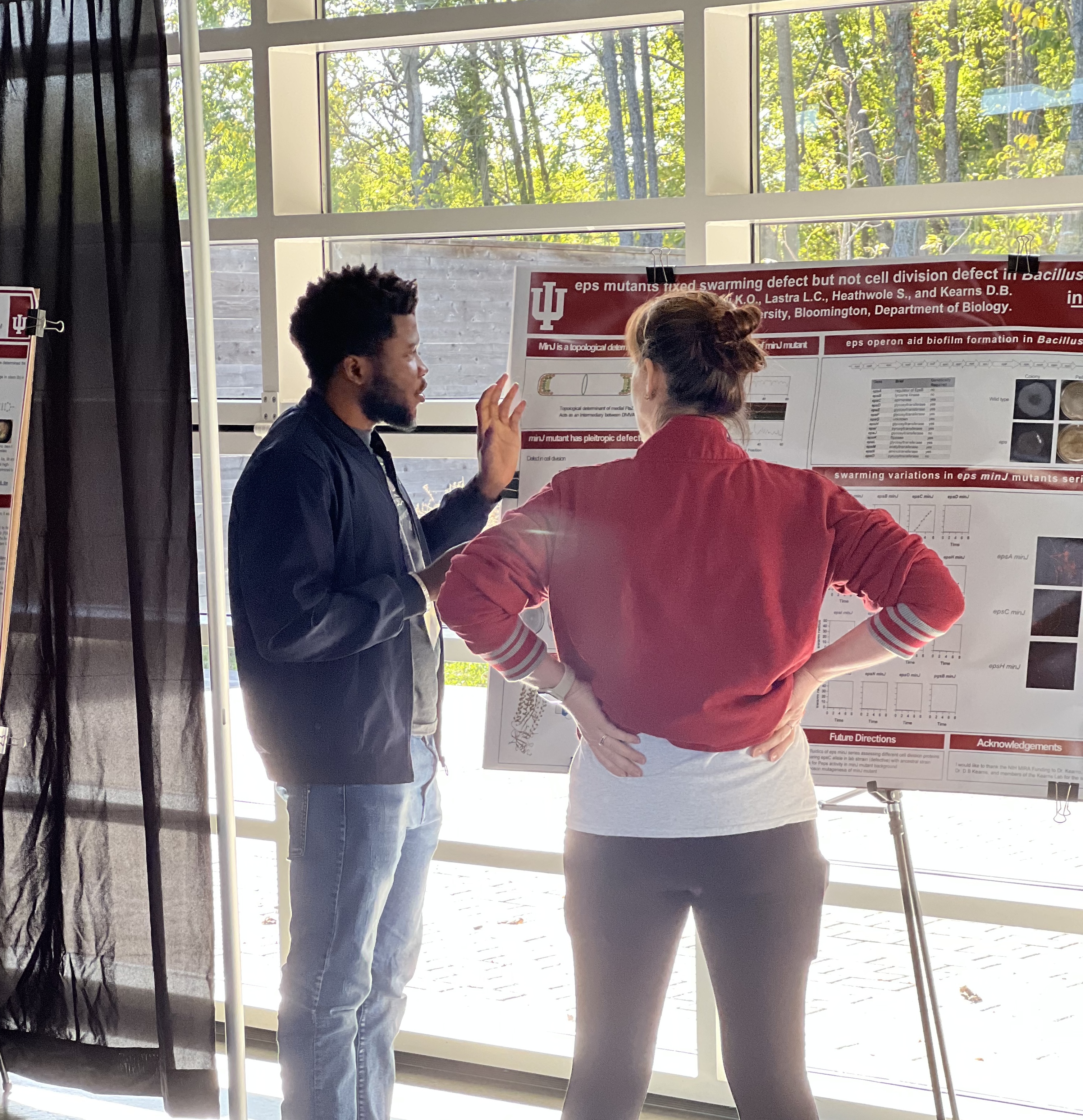 Kenny presenting scientific research at an academic poster session
